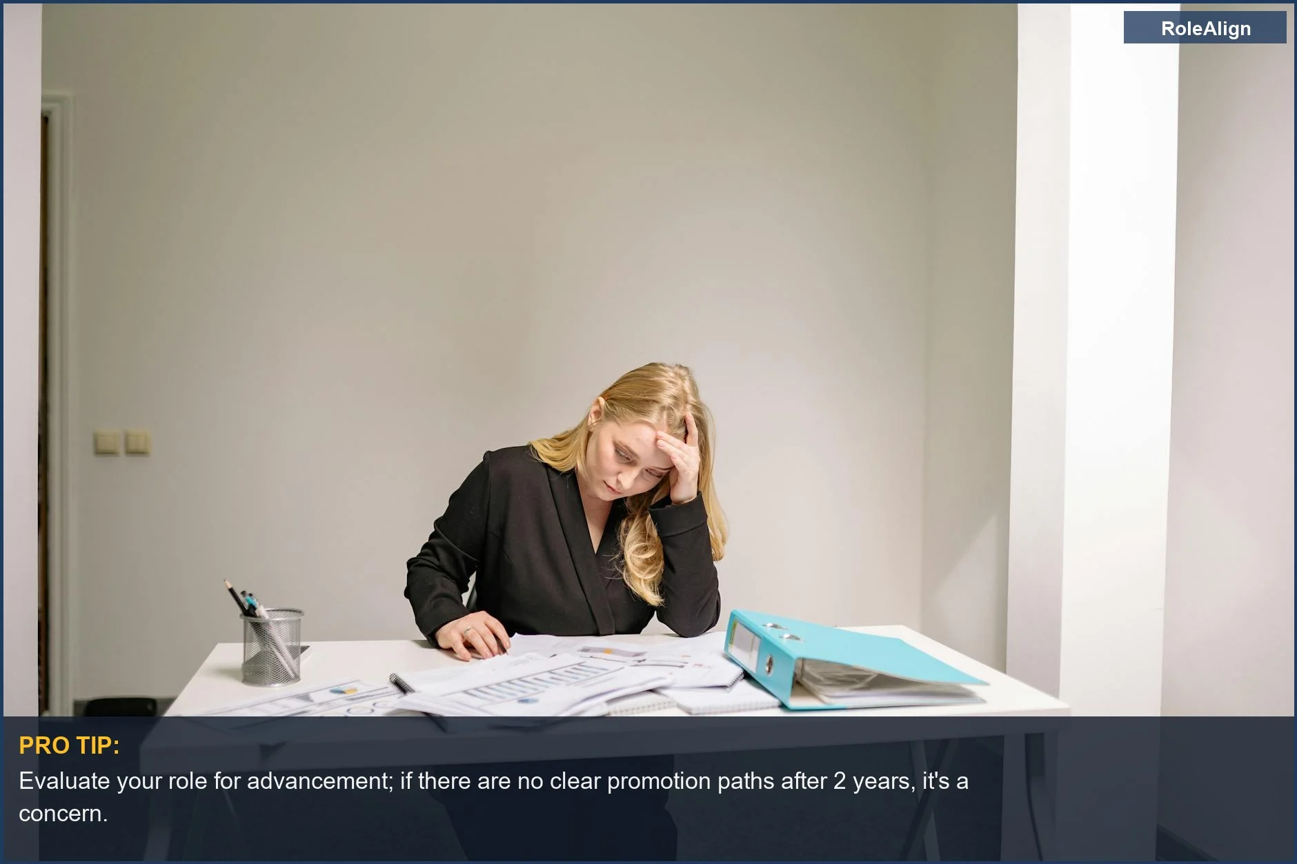 Businesswoman stressed by paperwork, illustrating the overwhelming nature of dead end job tasks.