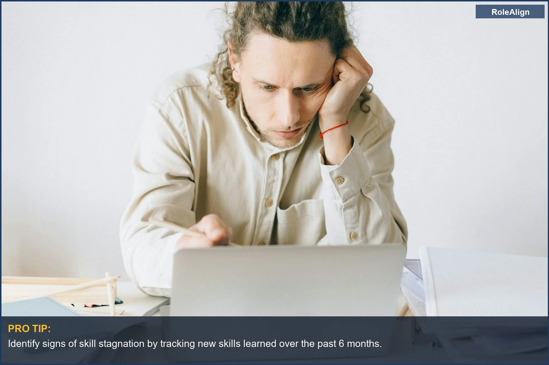 Man experiencing burnout and stress at his desk, a clear sign of a no growth job.