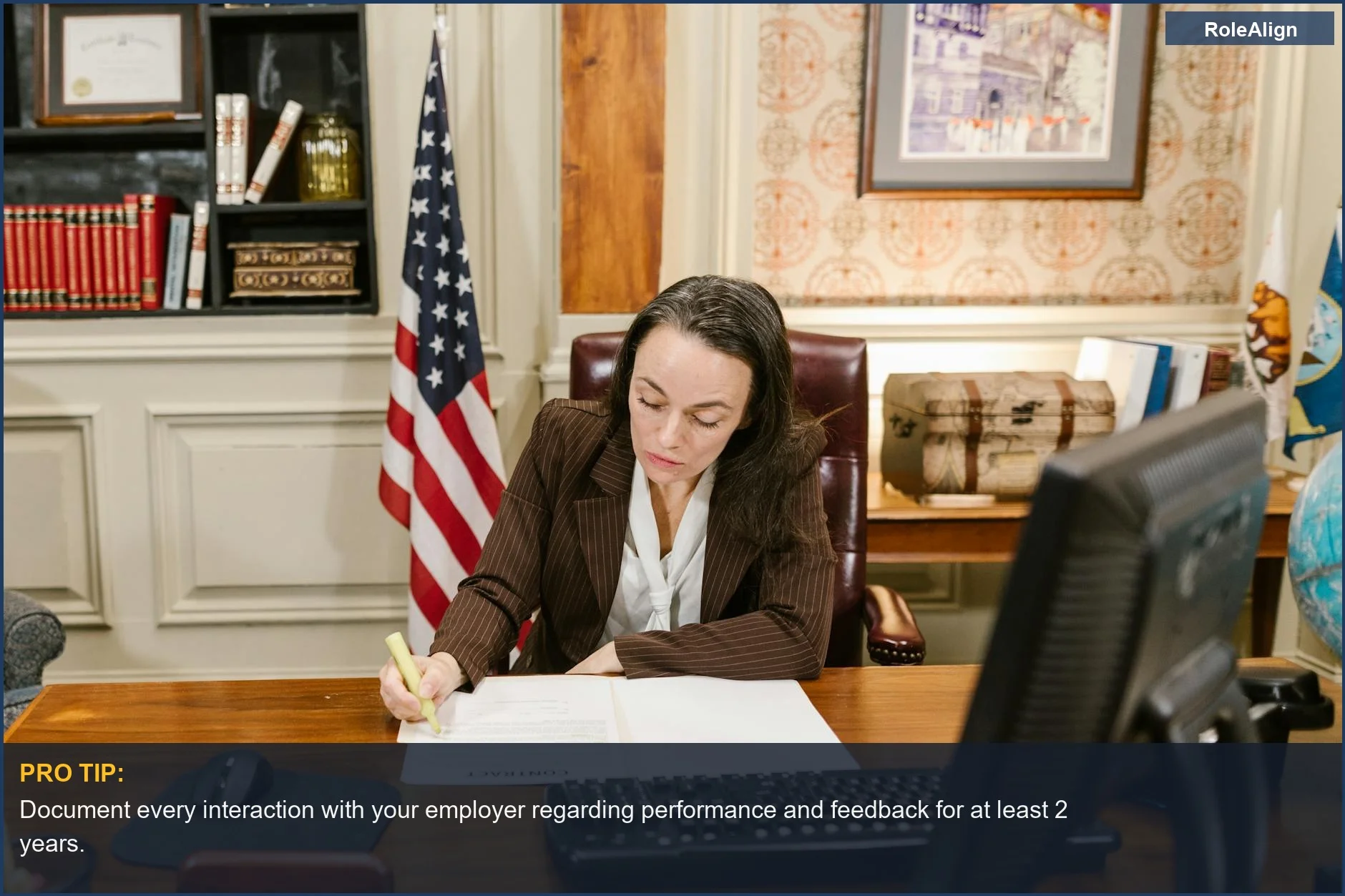 Female attorney signs legal documents, symbolizing justice in wrongful termination cases.