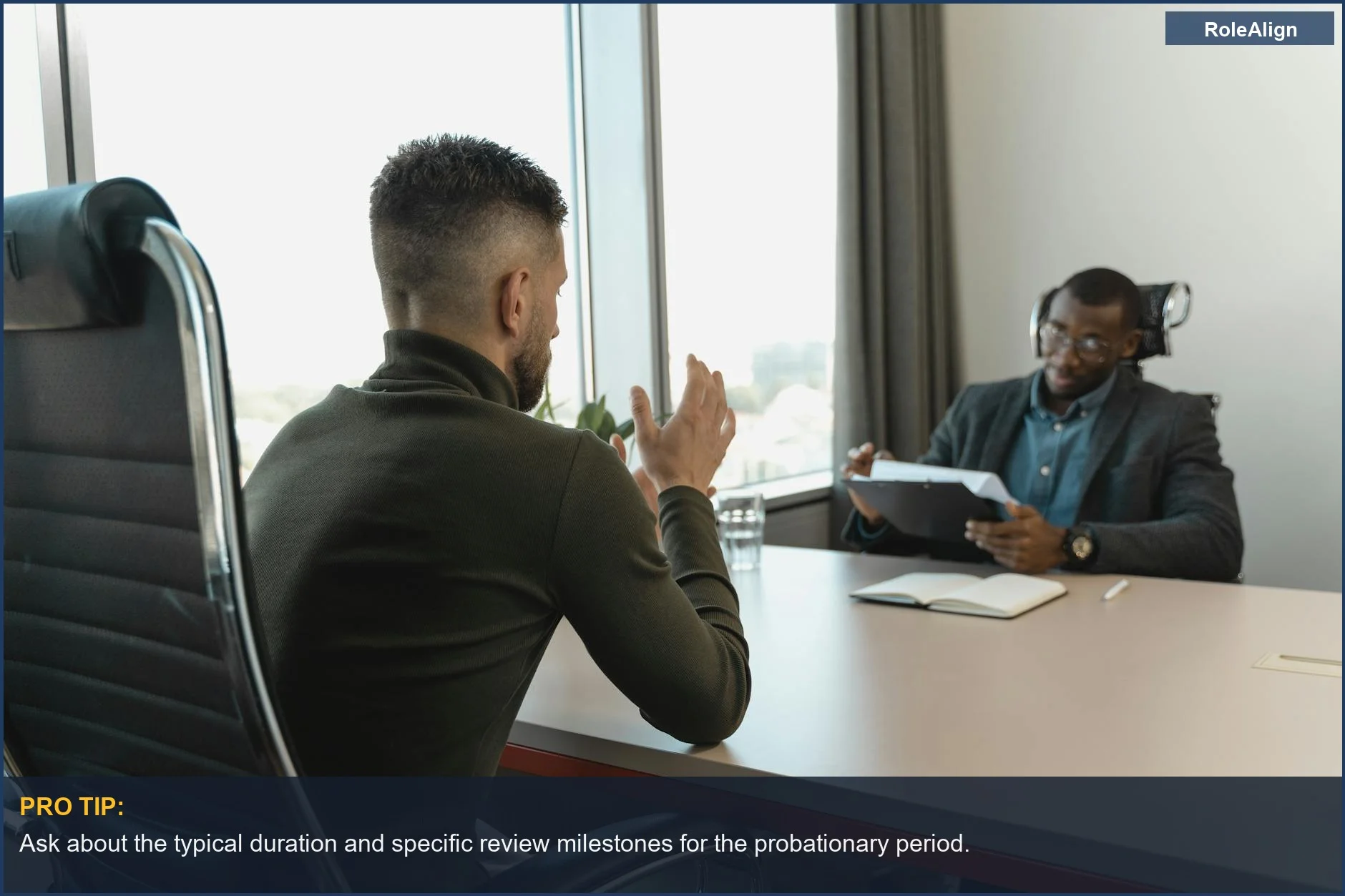 Two men in a job interview, discussing the probationary period what to know for new hires.