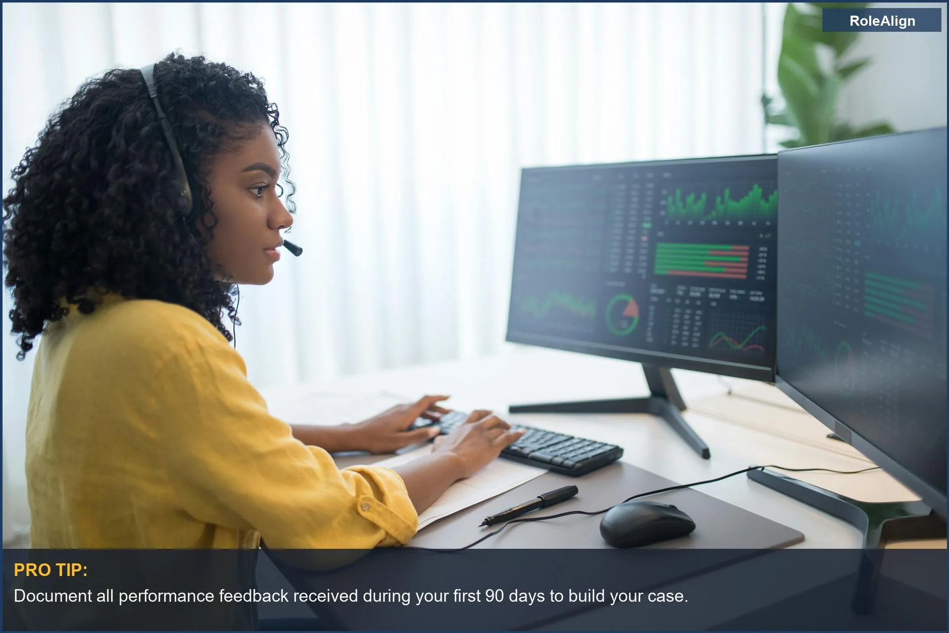 African American woman analyzing data on dual monitors, understanding her probation period rights.