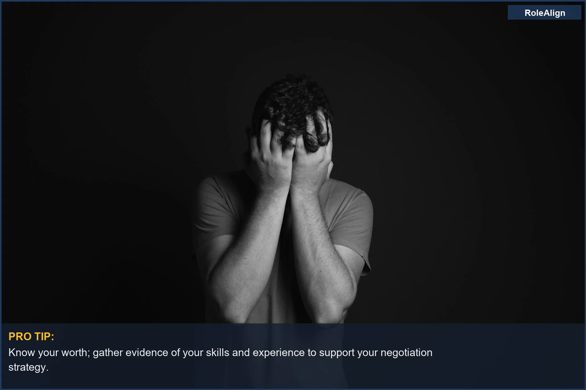 Grayscale portrait of a man covering his face, illustrating the shock of an offer being pulled after negotiation.