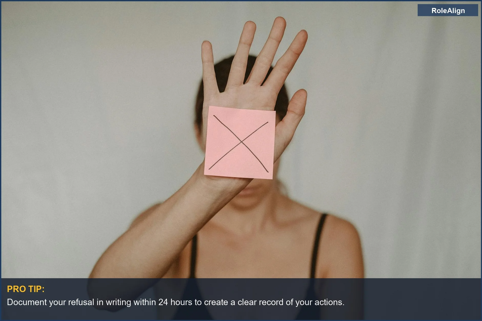 Woman showing a stop sign with her hand, refusing to sign a disciplinary write-up at work.