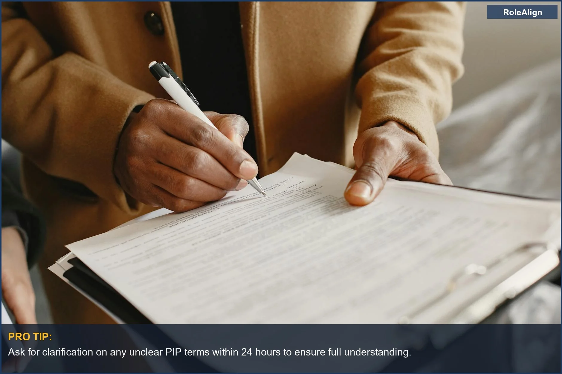 Close-up of a hand signing a critical document, signifying formal agreement to a performance improvement plan.
