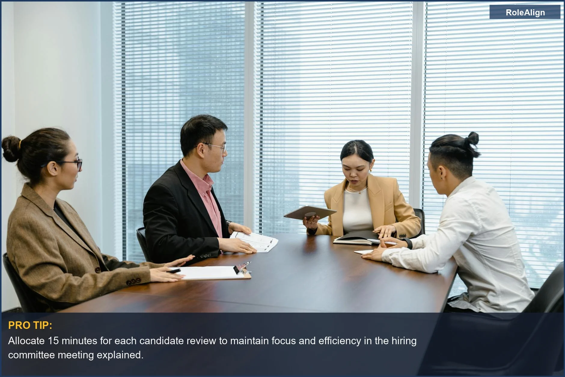 Professionals in a boardroom discussing strategies, illustrating the structured steps in the hiring committee meeting explained.