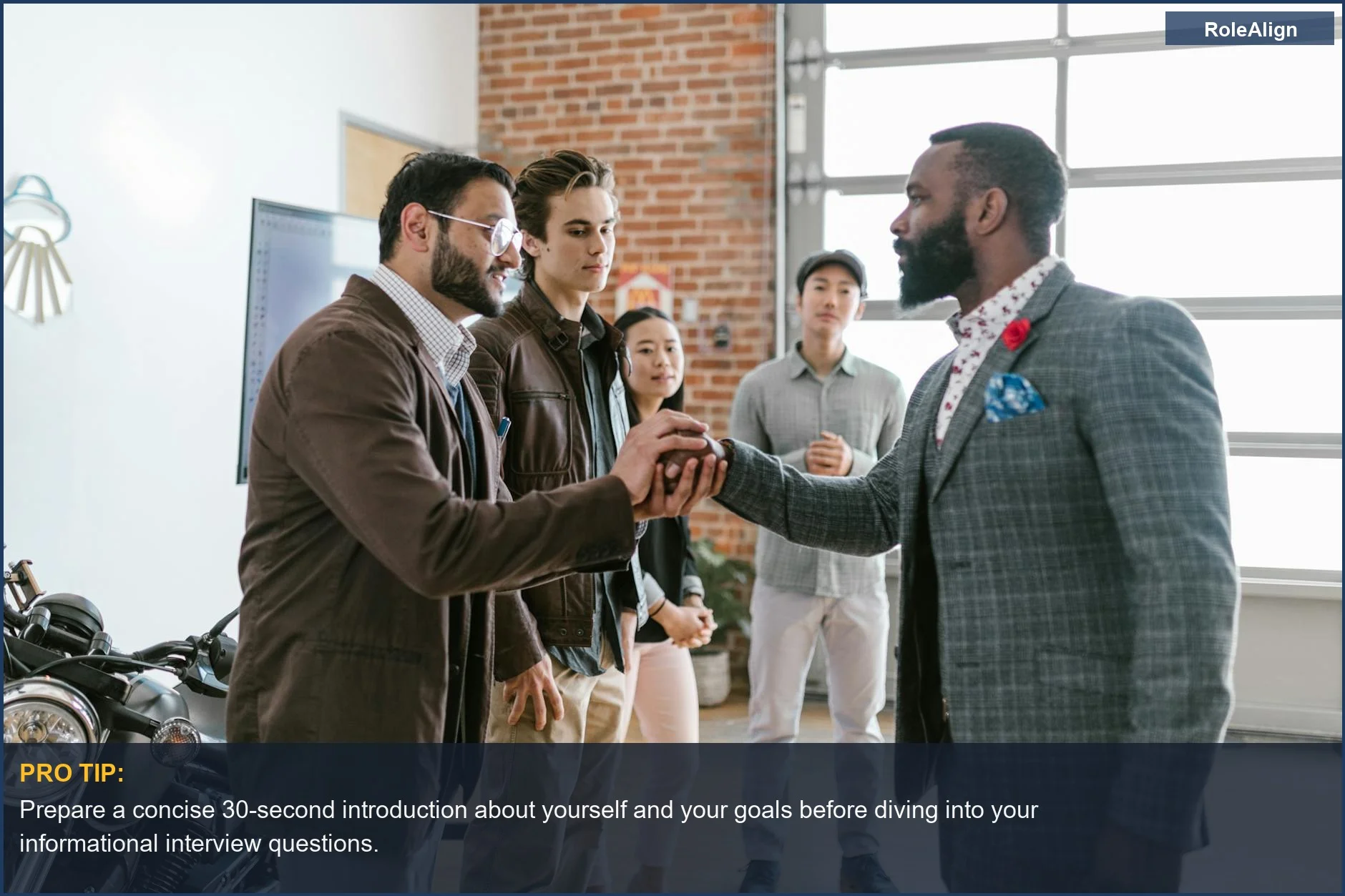 Diverse entrepreneurs greeting each other in a modern office, showcasing structured learning in informational interviews.