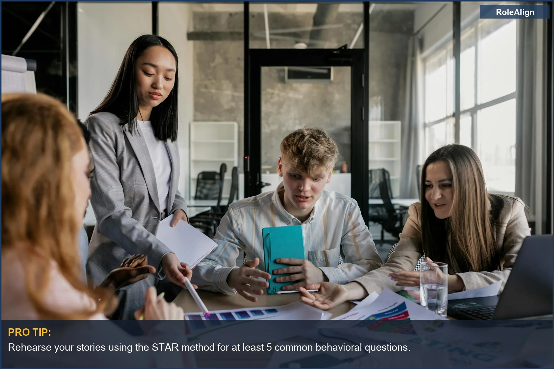 Colleagues in a lively discussion, illustrating how interviewers assess presentation beyond factual answers.