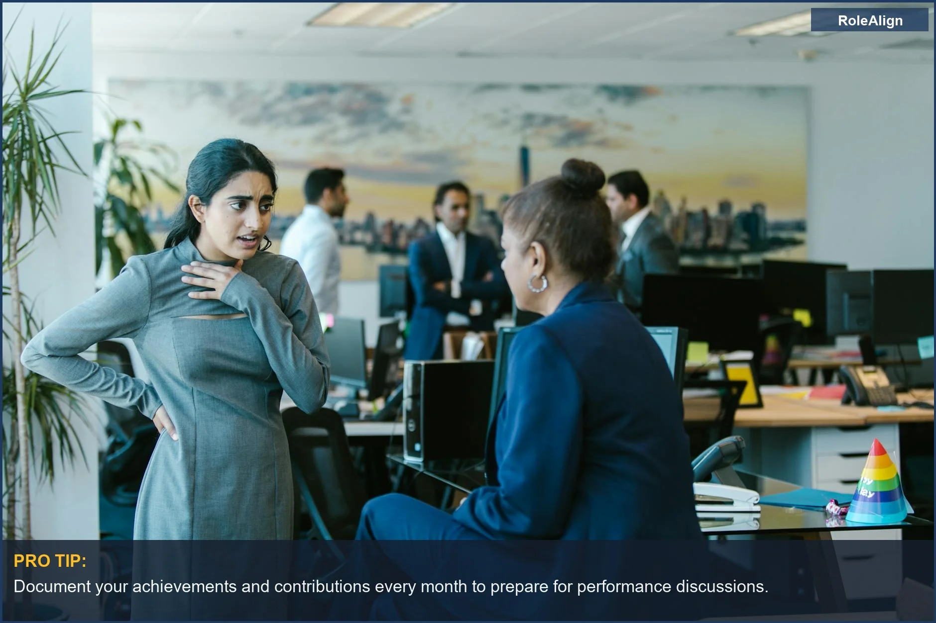 Employees in a contemporary office discussing performance and potential development opportunities.