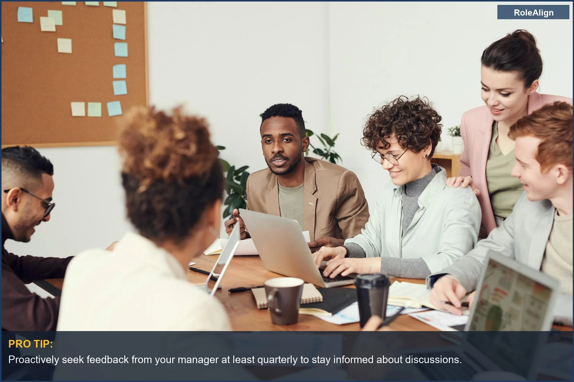 Multicultural team discusses employee performance during a closed-door manager meeting.