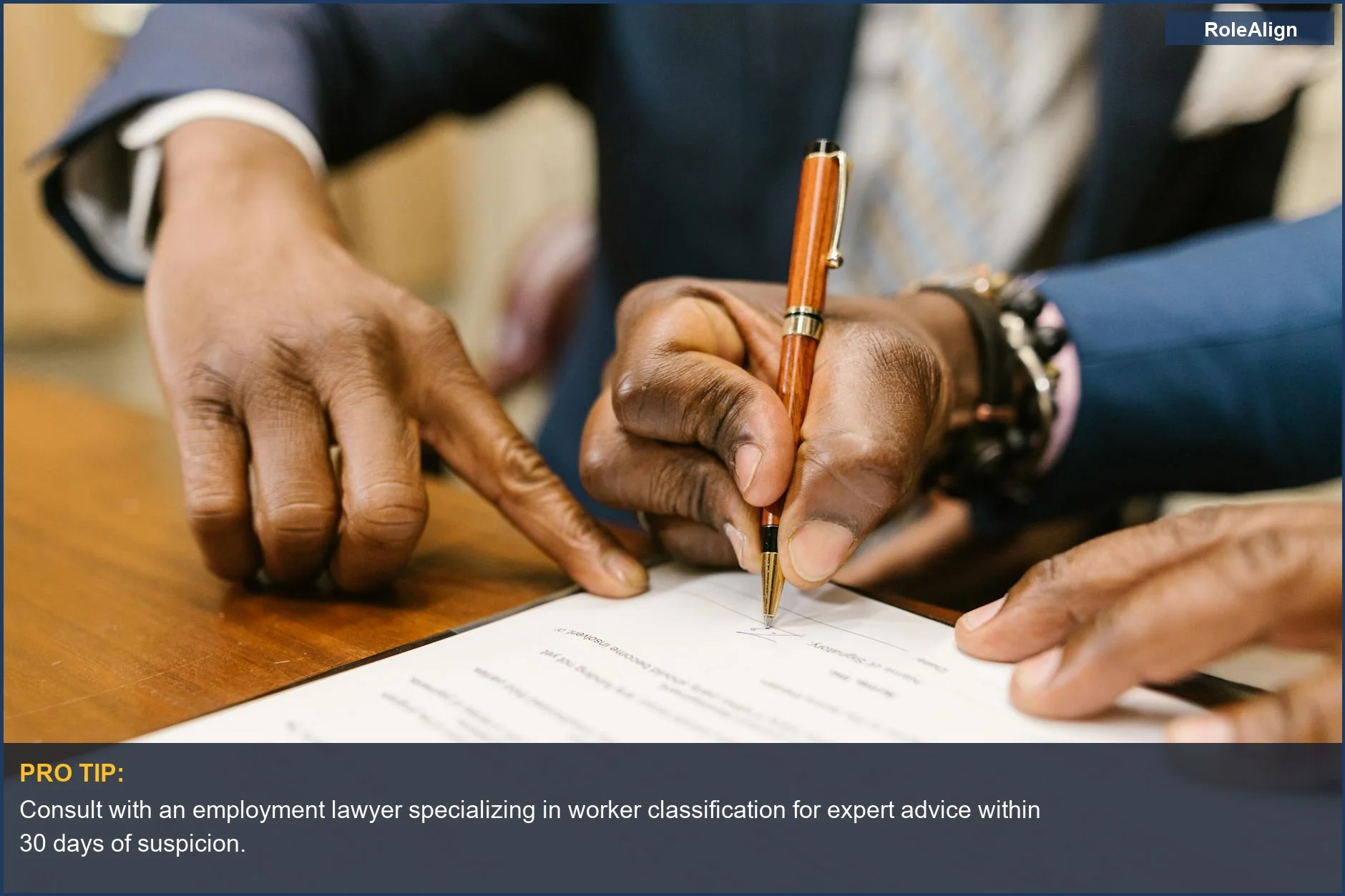 Business professionals sign legal contract, illustrating the complexities of employer misclassification.