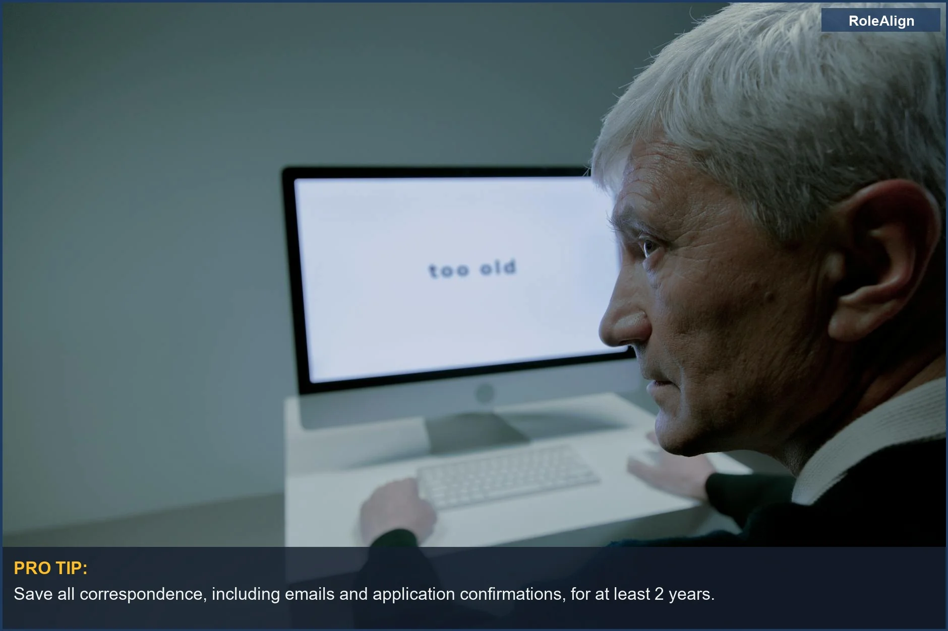 Frustrated senior man receives ageist message on computer during his job search.