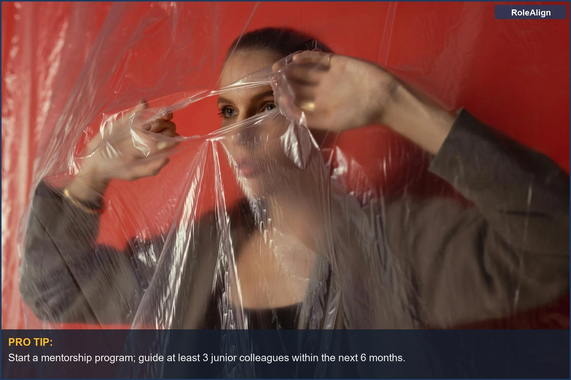 Woman behind plastic sheeting, conveying the idea of being too valuable to promote and career limitations.