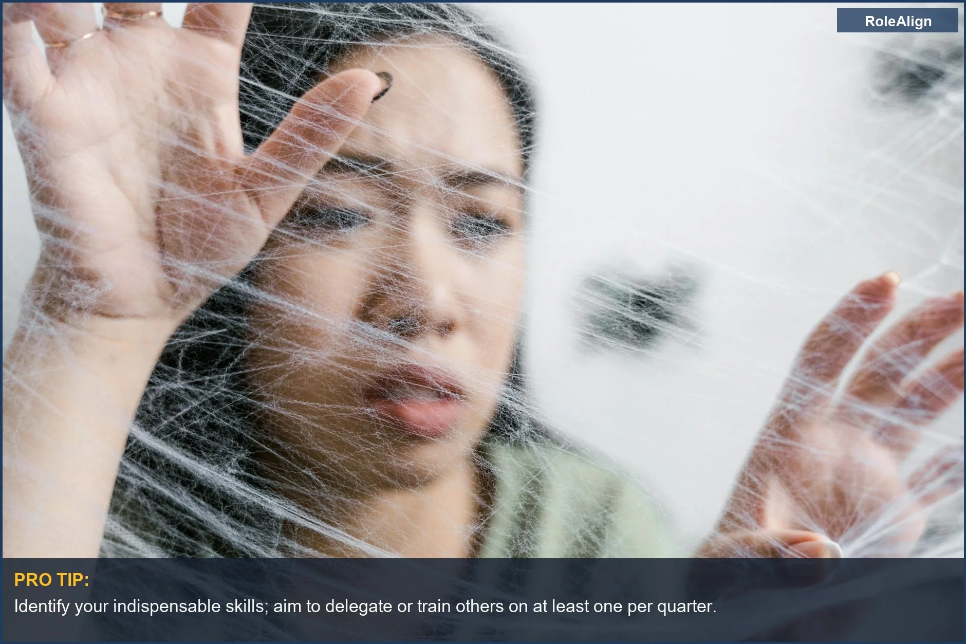 Woman caught in a spider web, illustrating the feeling of being irreplaceable at work and career entrapment.