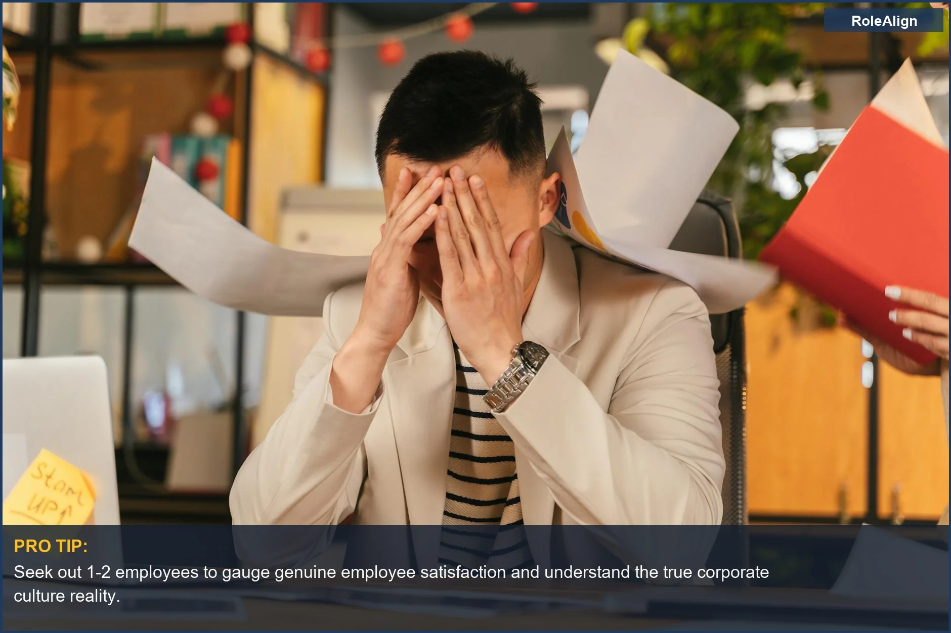 Overwhelmed businessman buried in paperwork, showing the stress of a non-existent company culture.