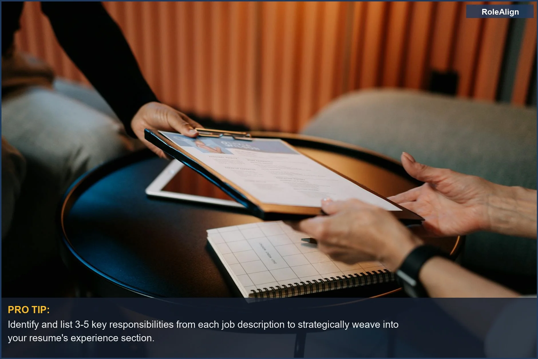 Business professionals in a meeting exchanging resumes to advance careers through tailored applications.