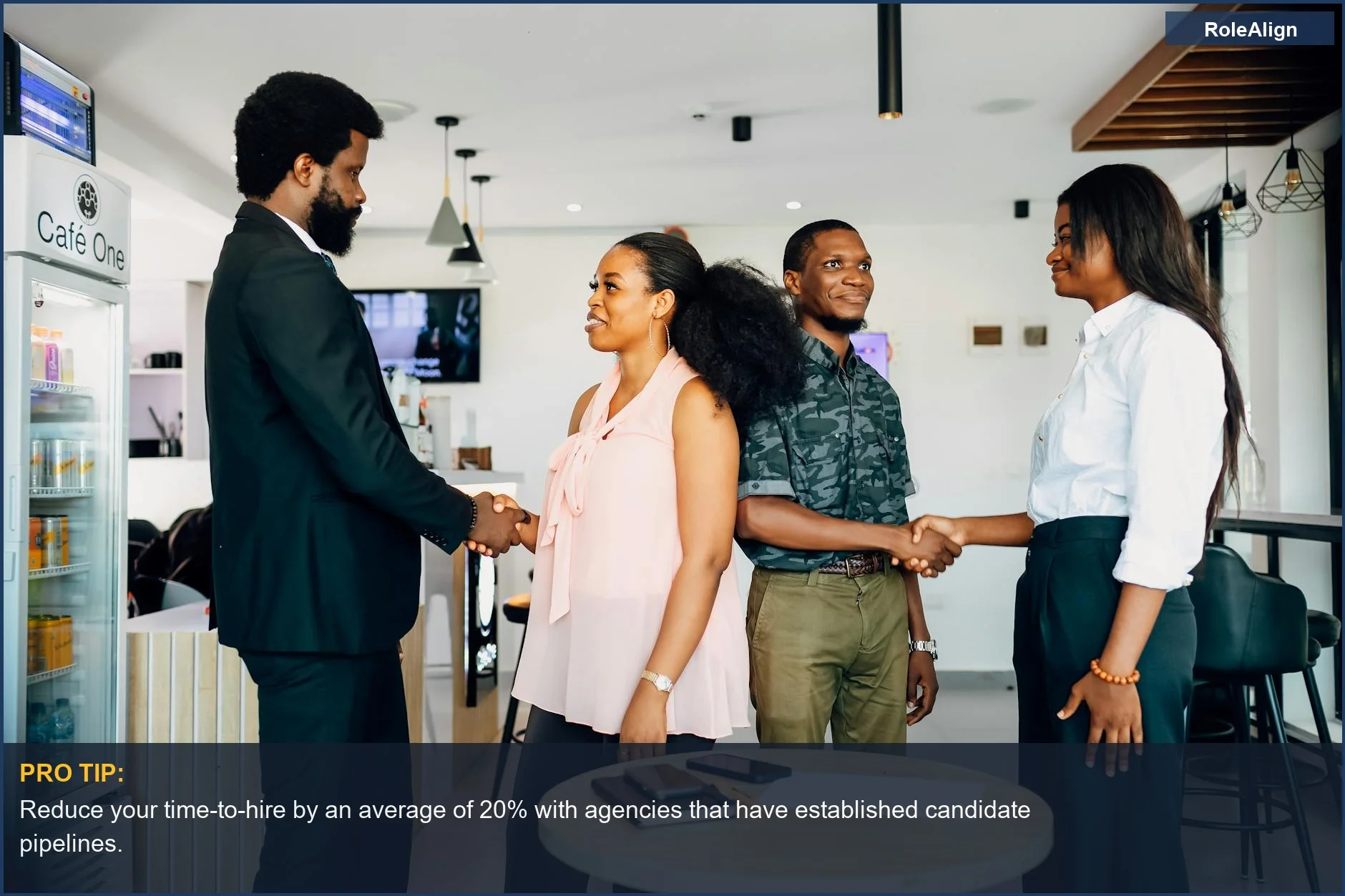Business meeting with a handshake in a Lagos cafe, demonstrating teamwork and why companies hire recruitment agencies for fast hiring.