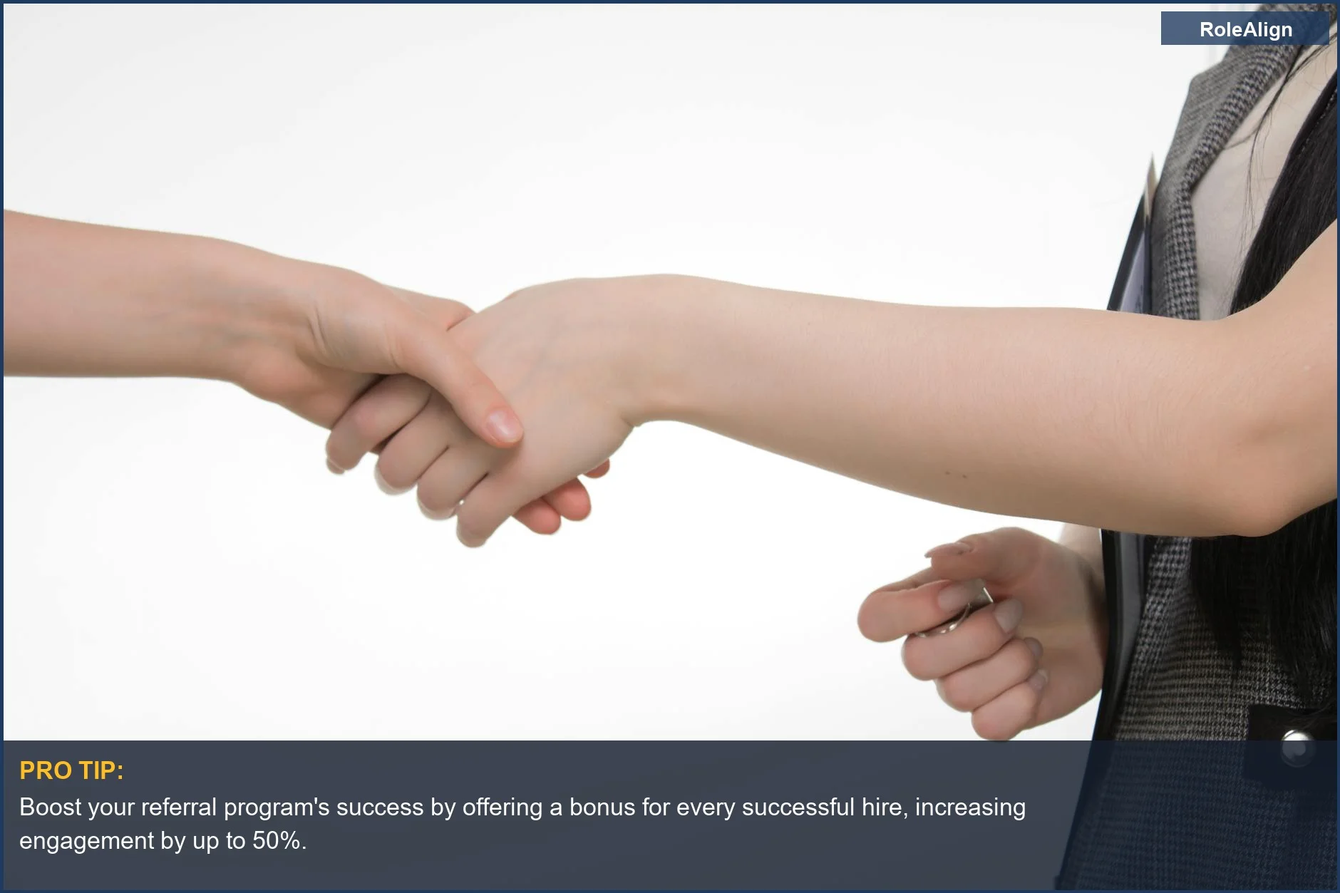Two professionals shaking hands, symbolizing trust in employee referral hiring for better candidate quality.