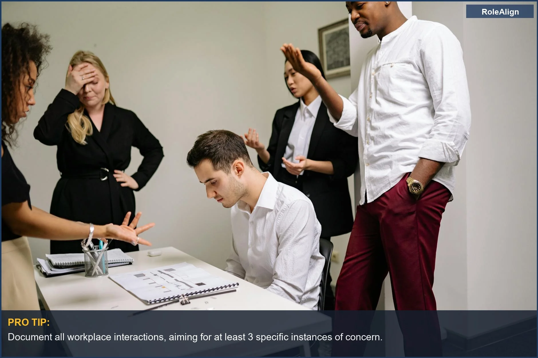 Business professionals in a serious discussion, highlighting how HR protects company interests during conflict.