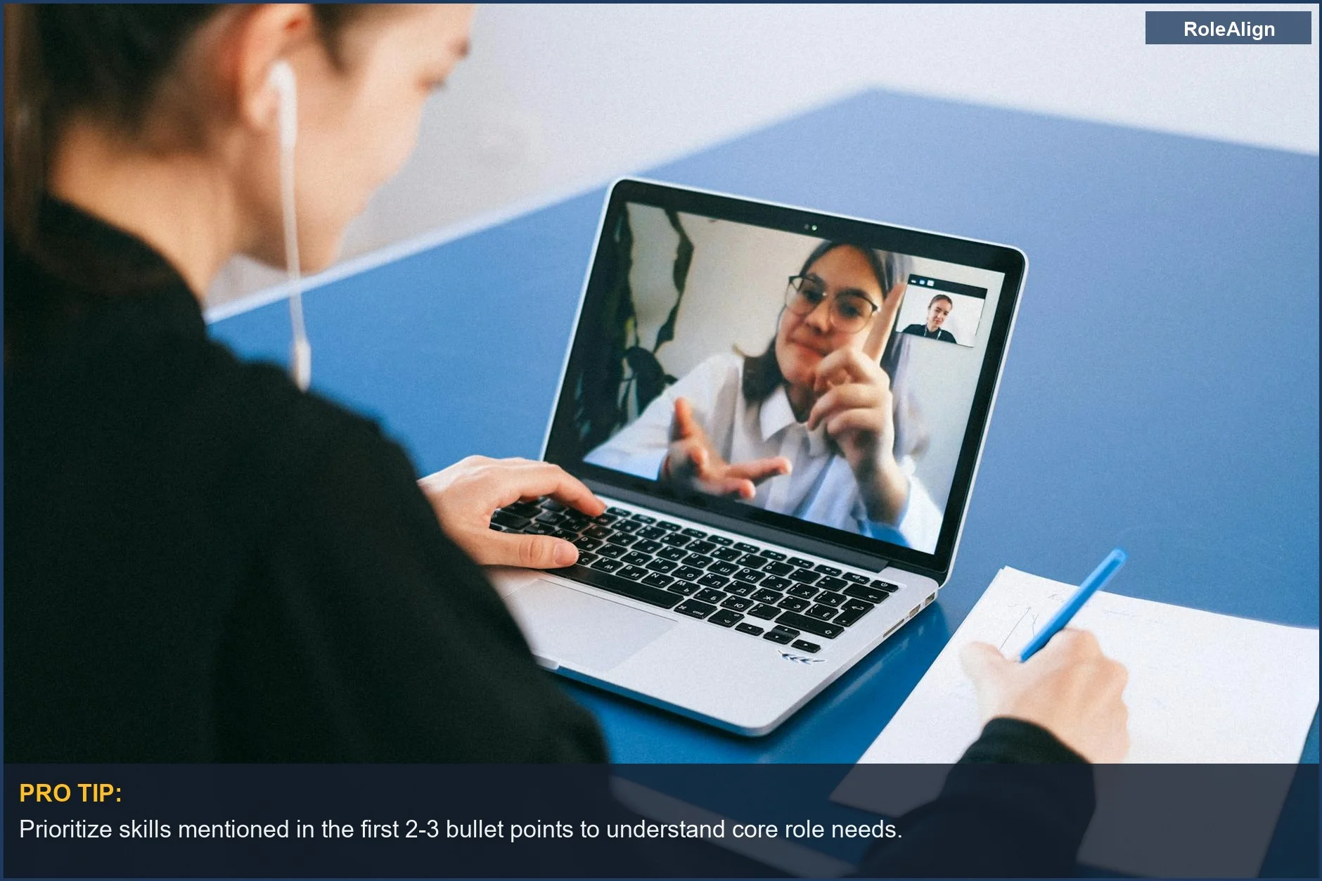 Woman taking notes during a virtual meeting, illustrating how to read job descriptions effectively.