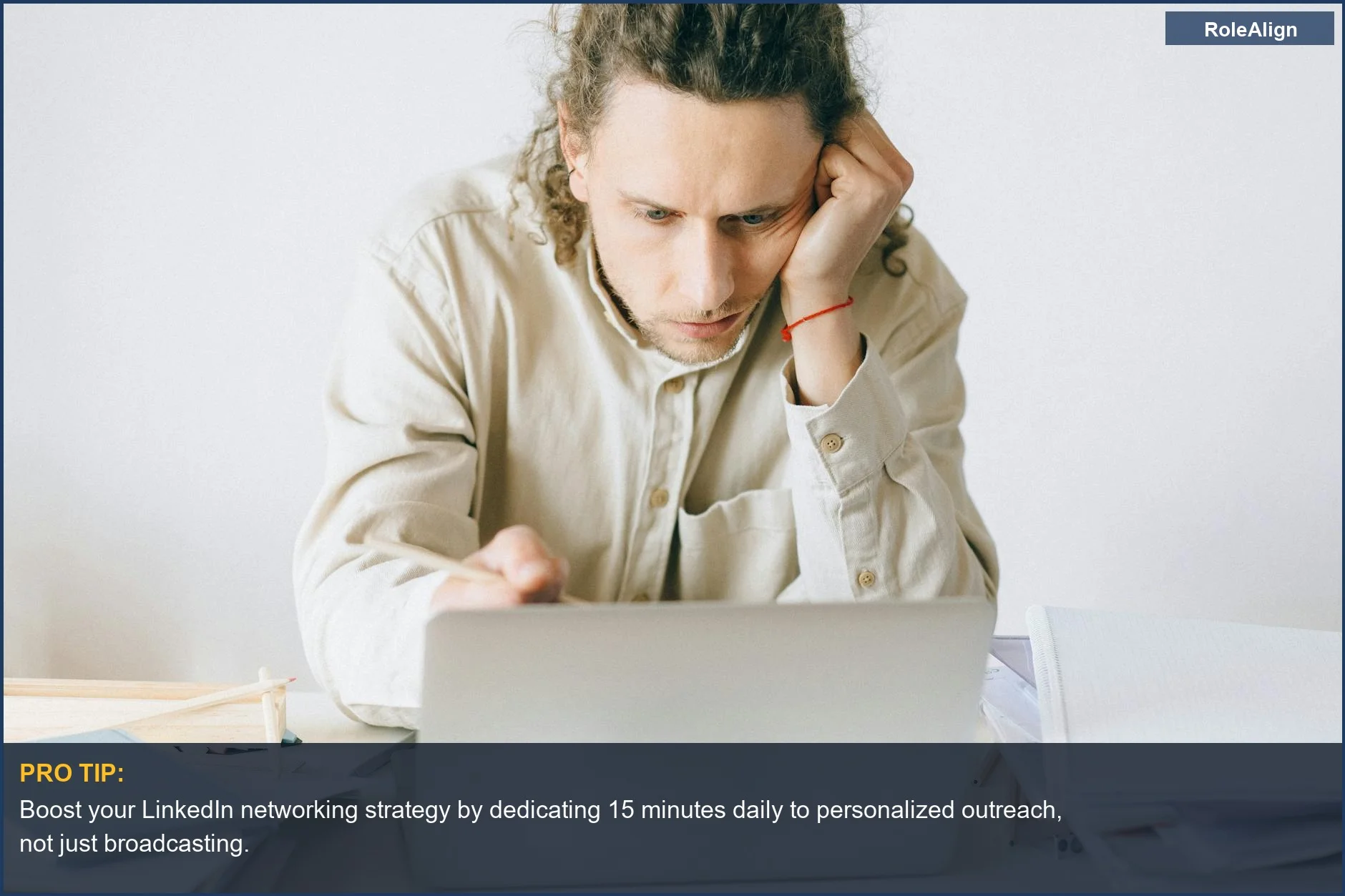 Overwhelmed man stressed at work, experiencing burnout while trying to manage LinkedIn networking strategy.