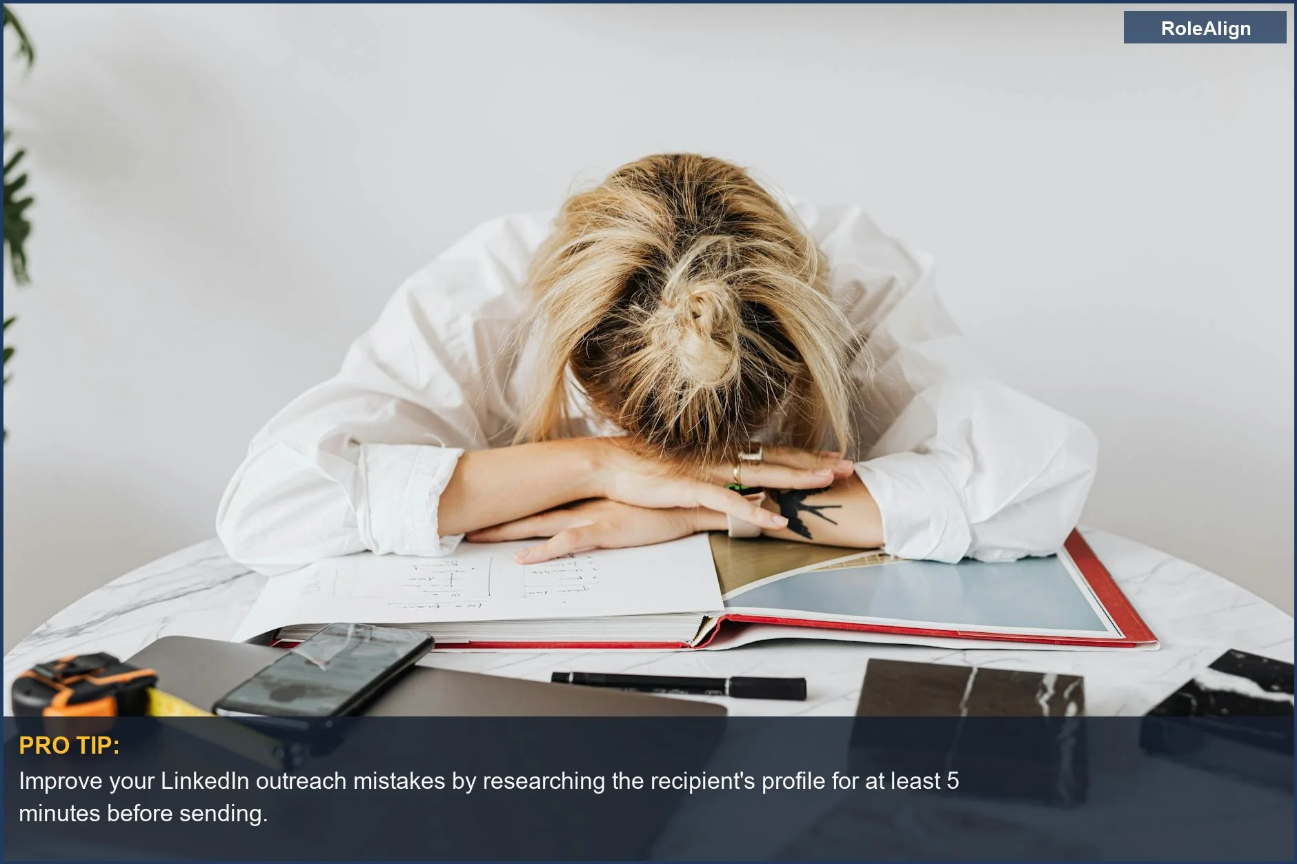Tired woman resting head on cluttered desk, highlighting the ignored LinkedIn connection request problem.