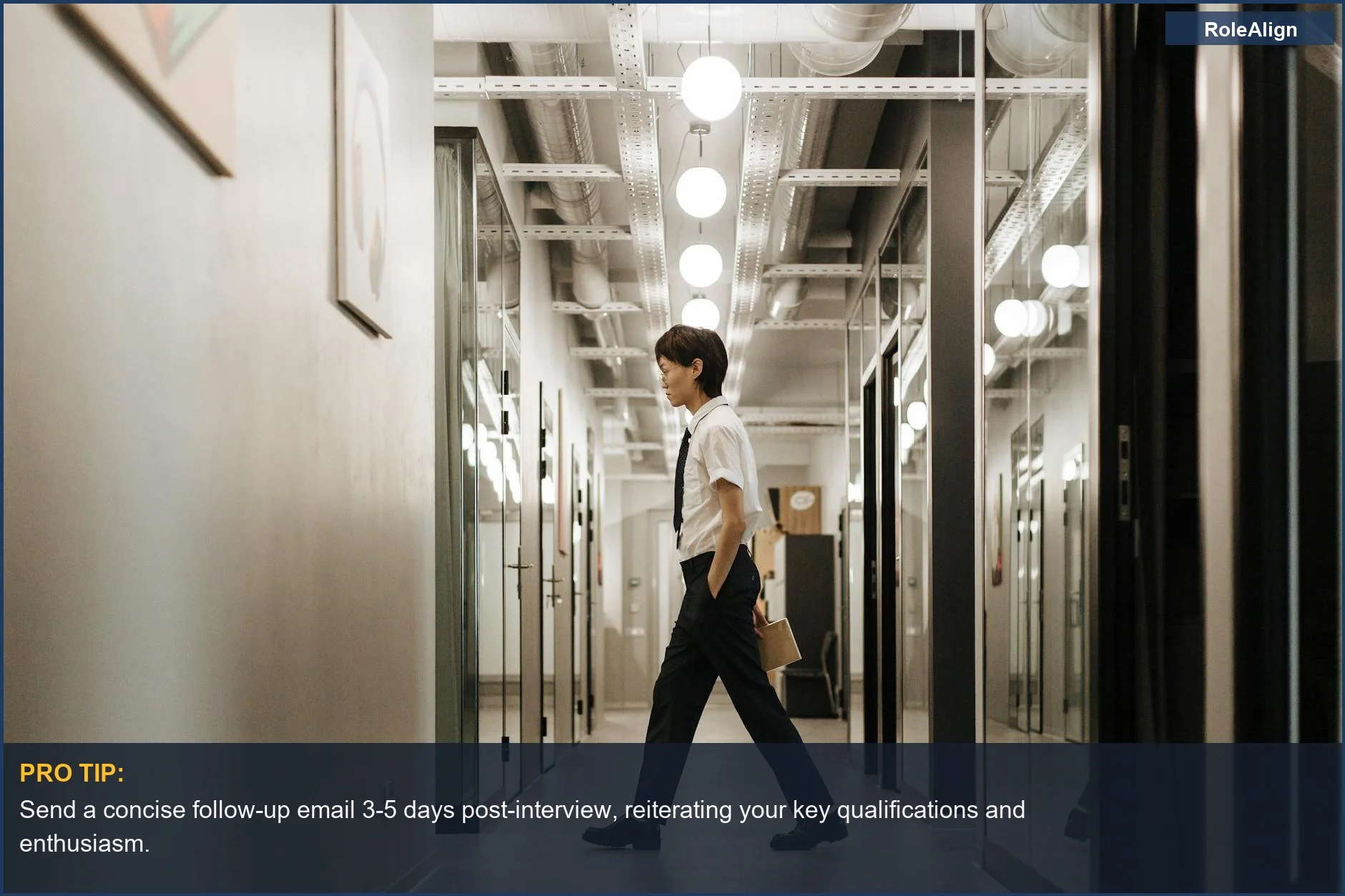 Confident professional walking through a modern office with glass walls, representing how to avoid recruiter ghosting.