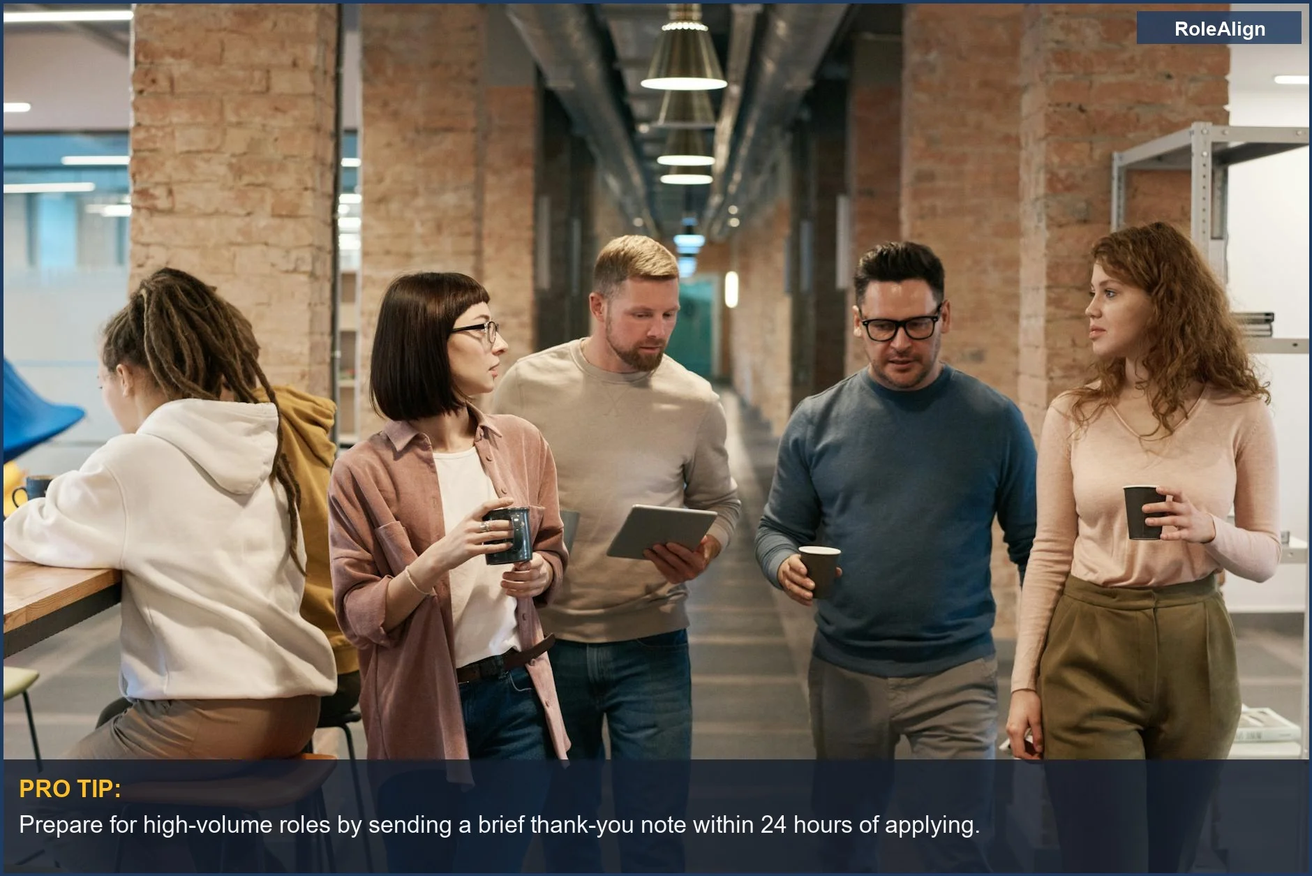 Diverse colleagues collaborating in a modern office hallway, showing real-world scenarios of recruiter ghosting.