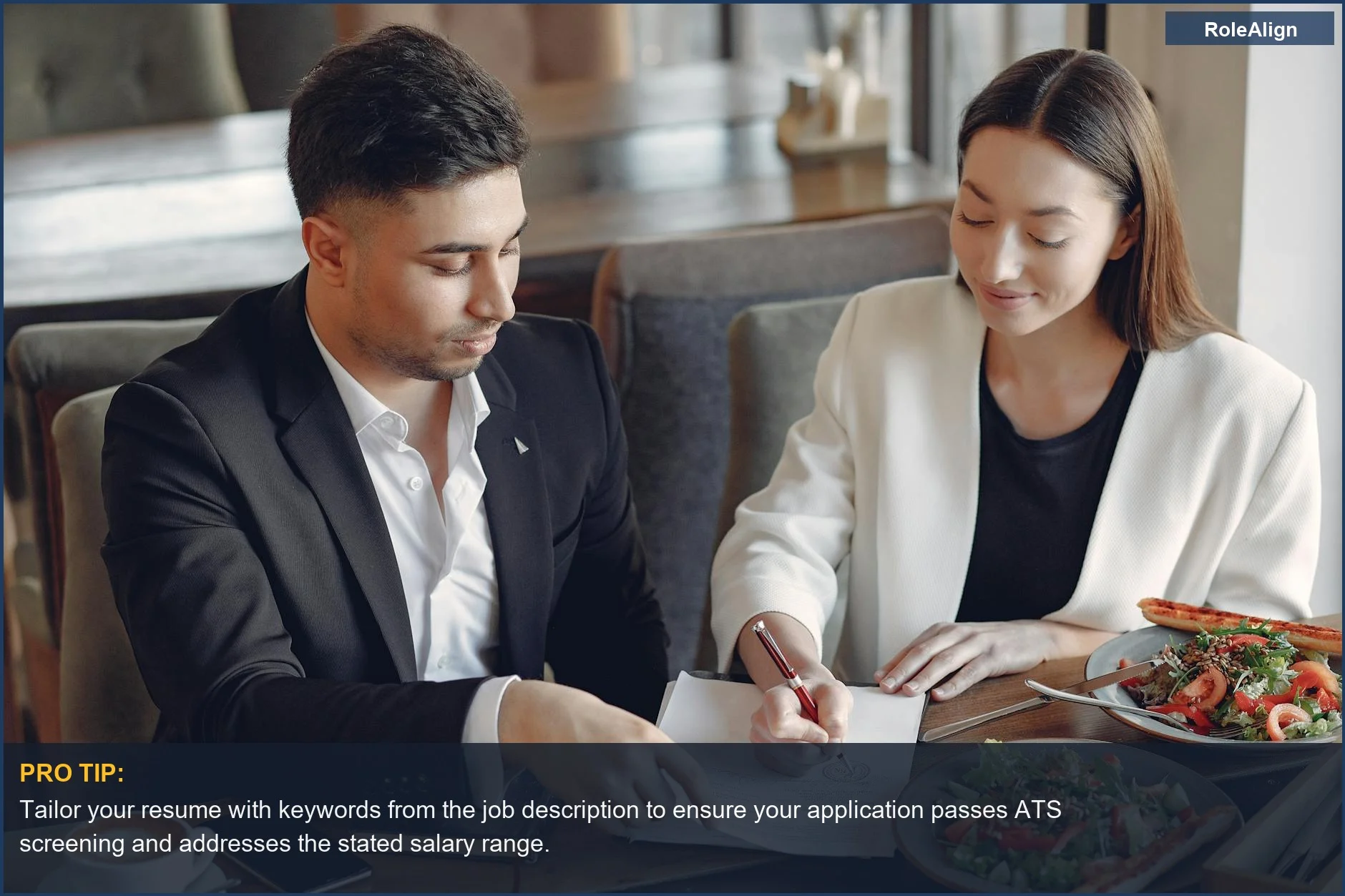 Multiethnic colleagues signing documents at a cafe, showing how job posting salary ranges impact ATS screening.