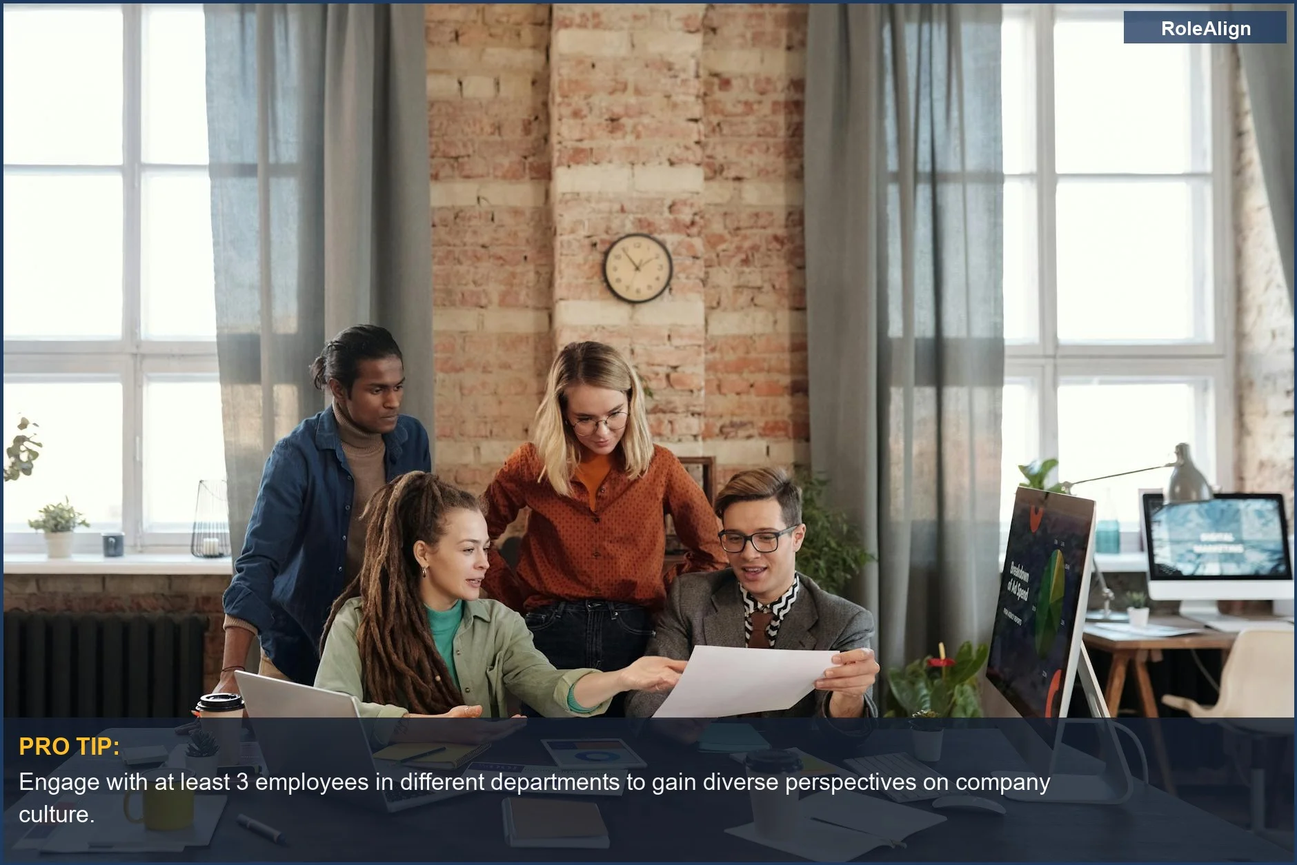 Diverse young professionals strategizing in an urban office, reflecting a forward-thinking workplace culture.