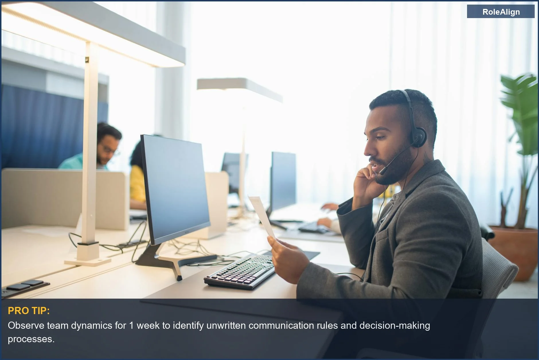 Professionals collaborating at modern desks, embodying a positive workplace culture insider understanding.